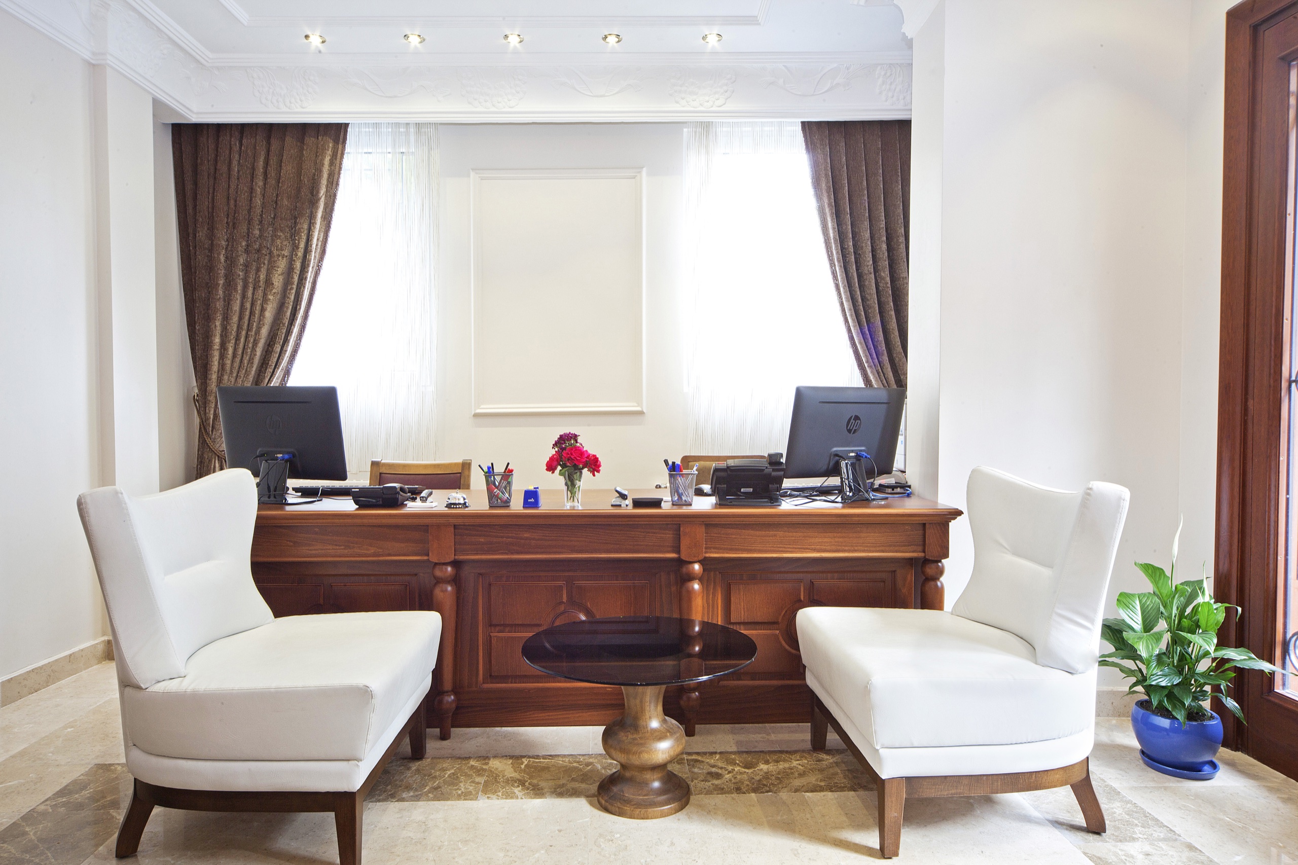 Aren Suites reception desk and lounge chairs