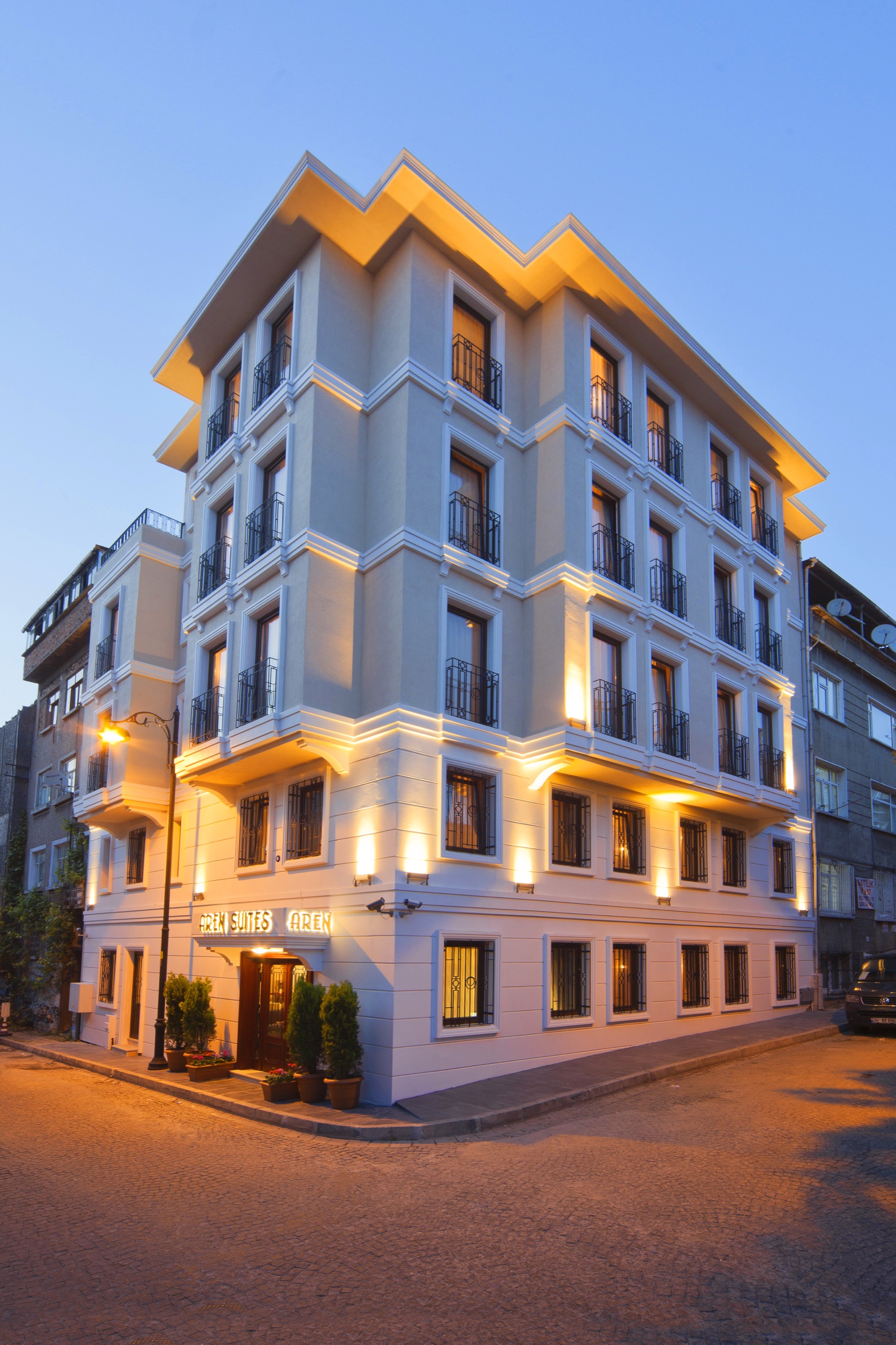 Aren Suites hotel exterior at dusk