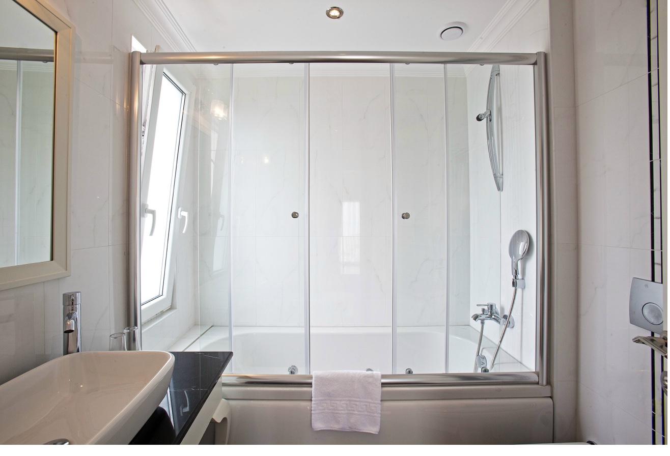 Standard Double Room bathroom vanity with mirror and amenities